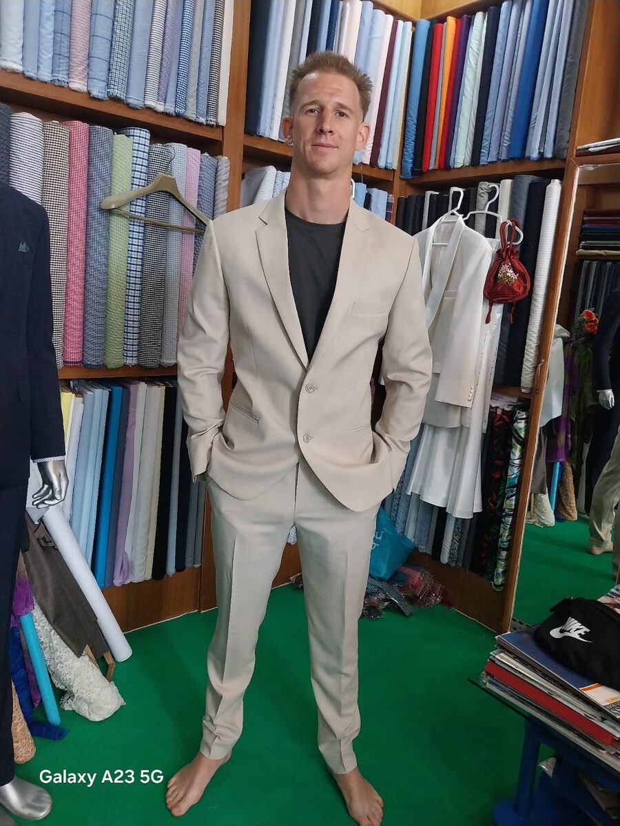 Client showcasing tailored suit