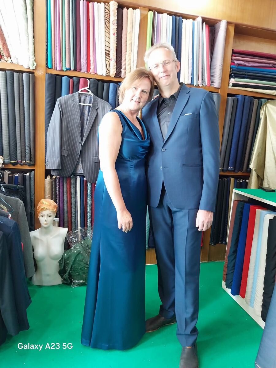 Couple in matching bespoke outfits