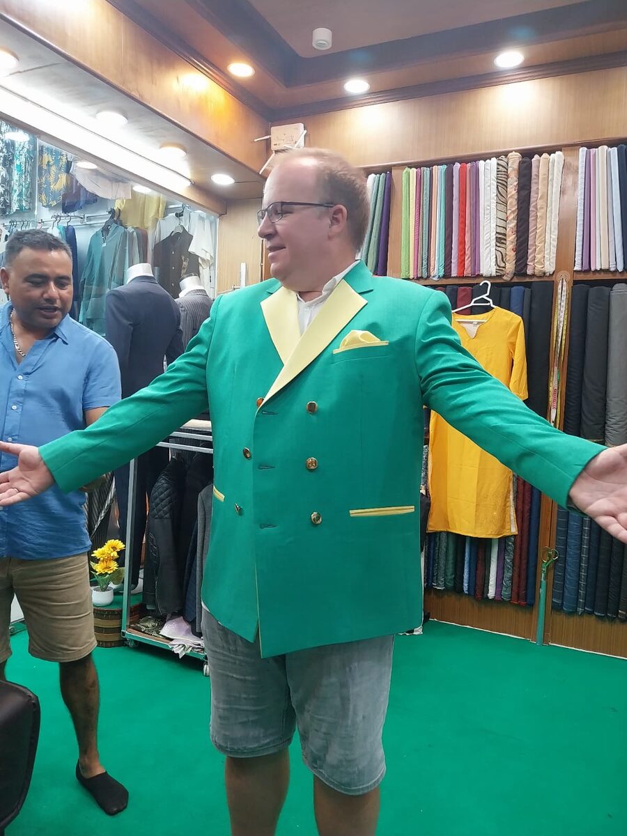 Customer in green bespoke jacket