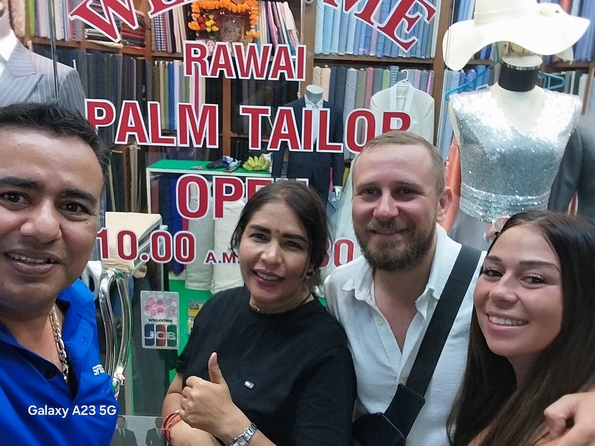 Master tailor with satisfied customer at Rawai Palm Tailor
