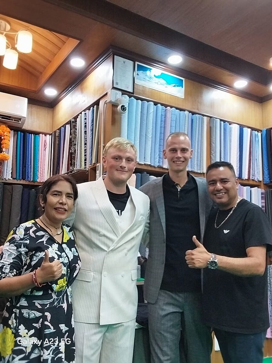 Our team with happy clients at the atelier